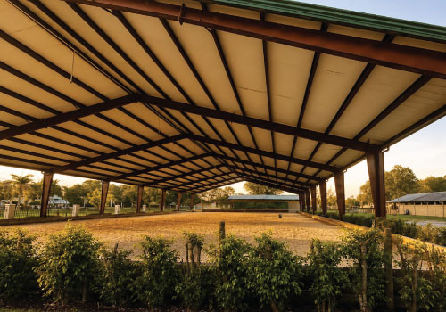 Horse covered arena at Darly Oaks Equestrian horse boarding barn near Stuart, Florida.